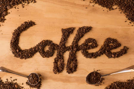 coffee text make from coffee bean on wooden backgroundの写真素材