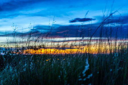 Mountain field during sunsetの写真素材