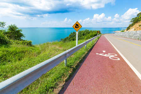 Bike lane and sea viewの写真素材