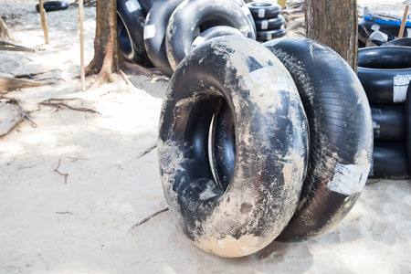 Black Life ring on the beach for swimming on the seaの写真素材