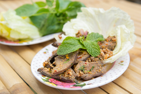 Cooked Liver in Spicy Condiment on bamboo floorの写真素材