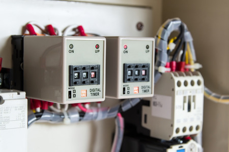 Electrical Digital timer in electronic control box (selective focus)の写真素材
