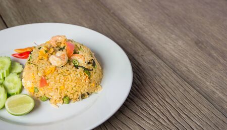 Shrimp fried rice on wood floor with space for textの写真素材