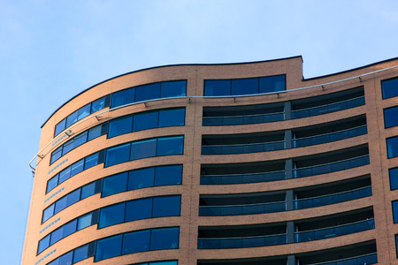 Abstract wavy blue windows of a modern structure in Rotterdamの写真素材