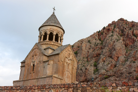 Armenian ancient Surb Astvatsatsin church of Noravank with red mountains behindの写真素材