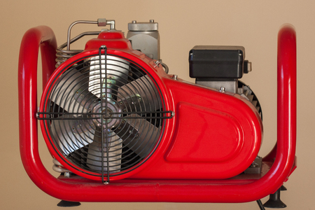 Red steel generator power supply with big fanの写真素材