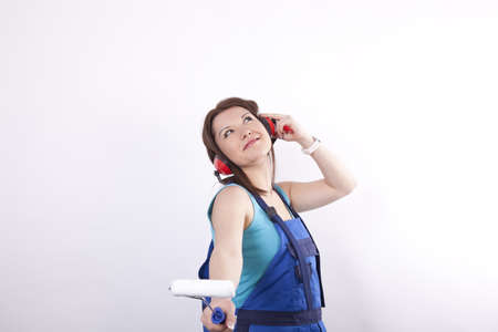 Young beautiful girl painter fooling around.の写真素材