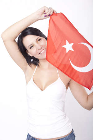 Girl showing flag of Turkey and smiling.の写真素材