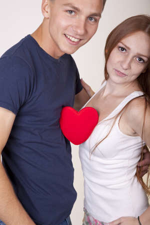 Young couple sharing a heart.の写真素材