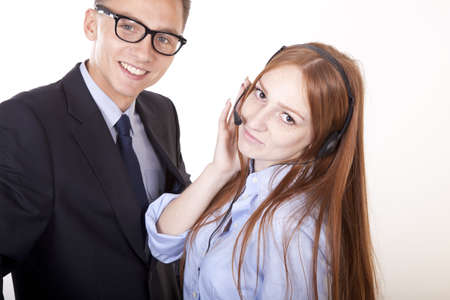 Young receptionists working and smiling.