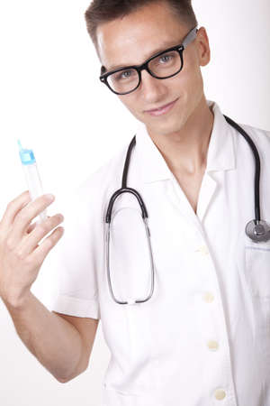 Portrait of a young attractive male doctor holding syringe.の写真素材
