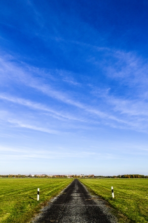 street to the horizon with blue sky の写真素材