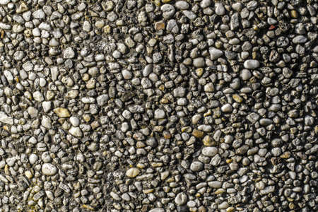 Old pebble stone wall pattern closeup の写真素材