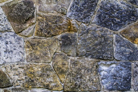 Old ntural stone wall pattern closeup  の写真素材
