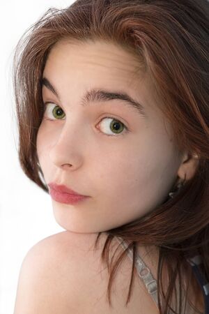 beautiful girl looking back over here shoulder, isolated on white.の写真素材