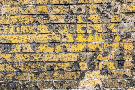 Old brick wall pattern closeup with bullet holes from WW2.の写真素材