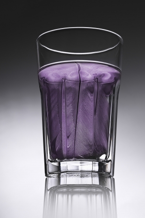simple water-glass with structured water in purple.の写真素材