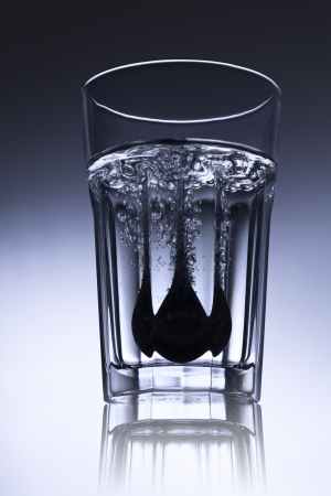 simple water-glass with spoon and bubbles.の写真素材