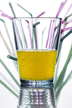 water glass with straws in the background の写真素材