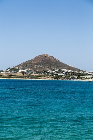 beautiful mountain with ocean in foreground, cloudless sky.の写真素材