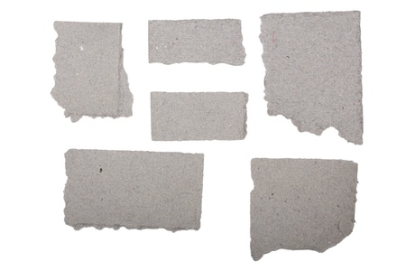 ripped  grey crumpled pieces of cardboard isolated on white.