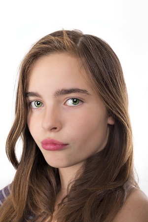 closeup portrait of a teenage girl kissing lips isolated on whiteの写真素材