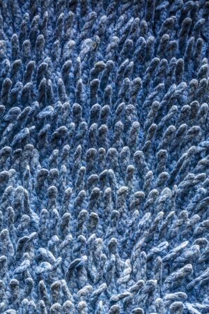 closeup of a blue carpet, background texture.の写真素材