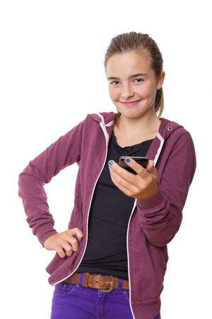 smiling teenage girl with mobile phone, , isolated on white.の写真素材