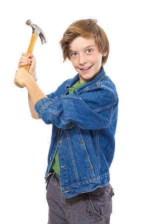lunatic teenage boy holding a hammer ready to hit, isolated on white.の写真素材