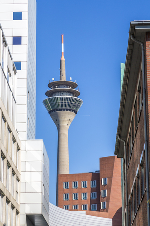 duesseldorf tv tower with modern architecture in front.の写真素材