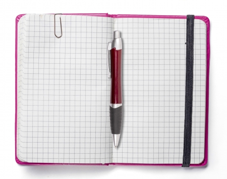 blank page of pink note book with paper clip and elastic strap and a red ball pen, isolated on white.の写真素材