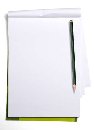 used old blank paper tablet and old pencil, isolated on white.の写真素材