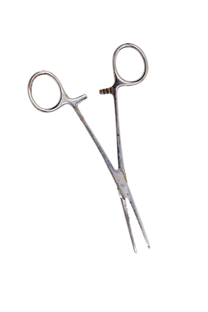 an old used medical clamp scissors, isolated on white.の写真素材