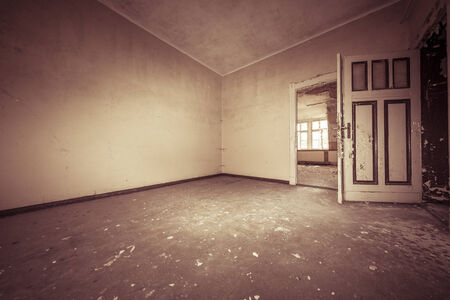 fish eye shoot of a empty dirty room with sepia color filter.の写真素材