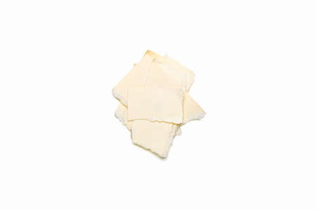 bunch of ripped yellow  pieces of paper, isolated on white.の写真素材