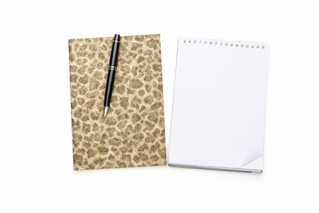 diary and note pad with black ball pen, isolated on white.の写真素材