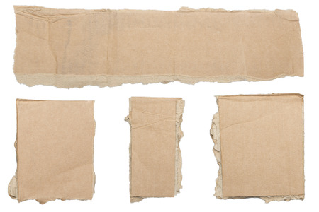 collection of ripped  brown pieces of cardboard, no shadows, isolated on white.の写真素材
