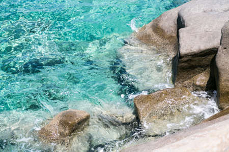 rocky ocean coast with turquoise waterの写真素材