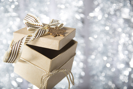 christmas gift box with golden star, bow and ribbonの写真素材