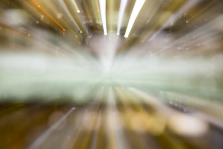 motion blurred background with bokeh, long exposure with zoom effectの写真素材