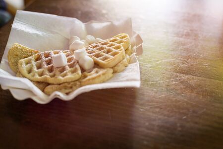 to go waffles with marshmallows on a table