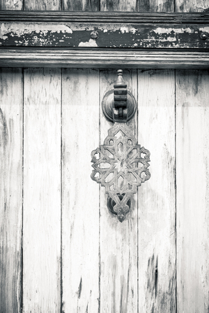 black and white shot of an oriental  door knockerの写真素材
