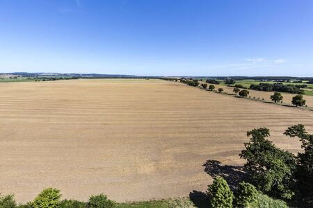 flat landscape in Mecklenburg, Germany with blue skyの写真素材