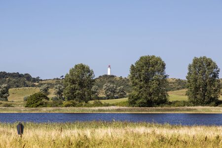 landscape on HIddensee island with lighthouse in backgroundの写真素材