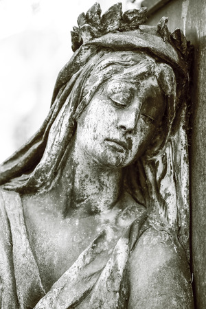 black and white shot of sad woman sculptureの写真素材