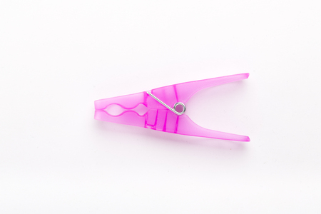 pink plastic clothespin, isolated on whiteの写真素材