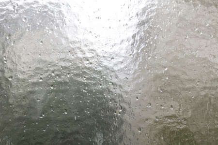structural glass pane with rain dropsの写真素材