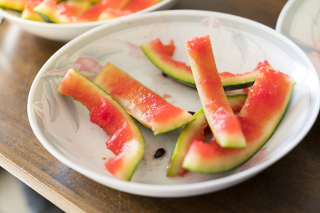 after meal, peel of a watermelon on a plateの写真素材