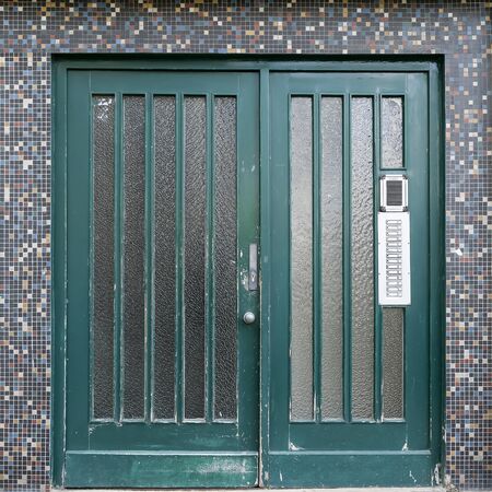 old grungy green entrance found in Berlin, Kreuzberg