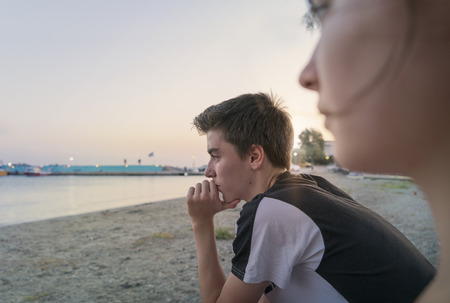 thoughtful young man look at the seaの写真素材